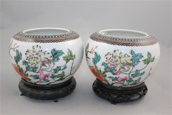 A pair of Chinese famille rose globular bowls, Qianlong marks, Republic period, 16.5cm diam, stands